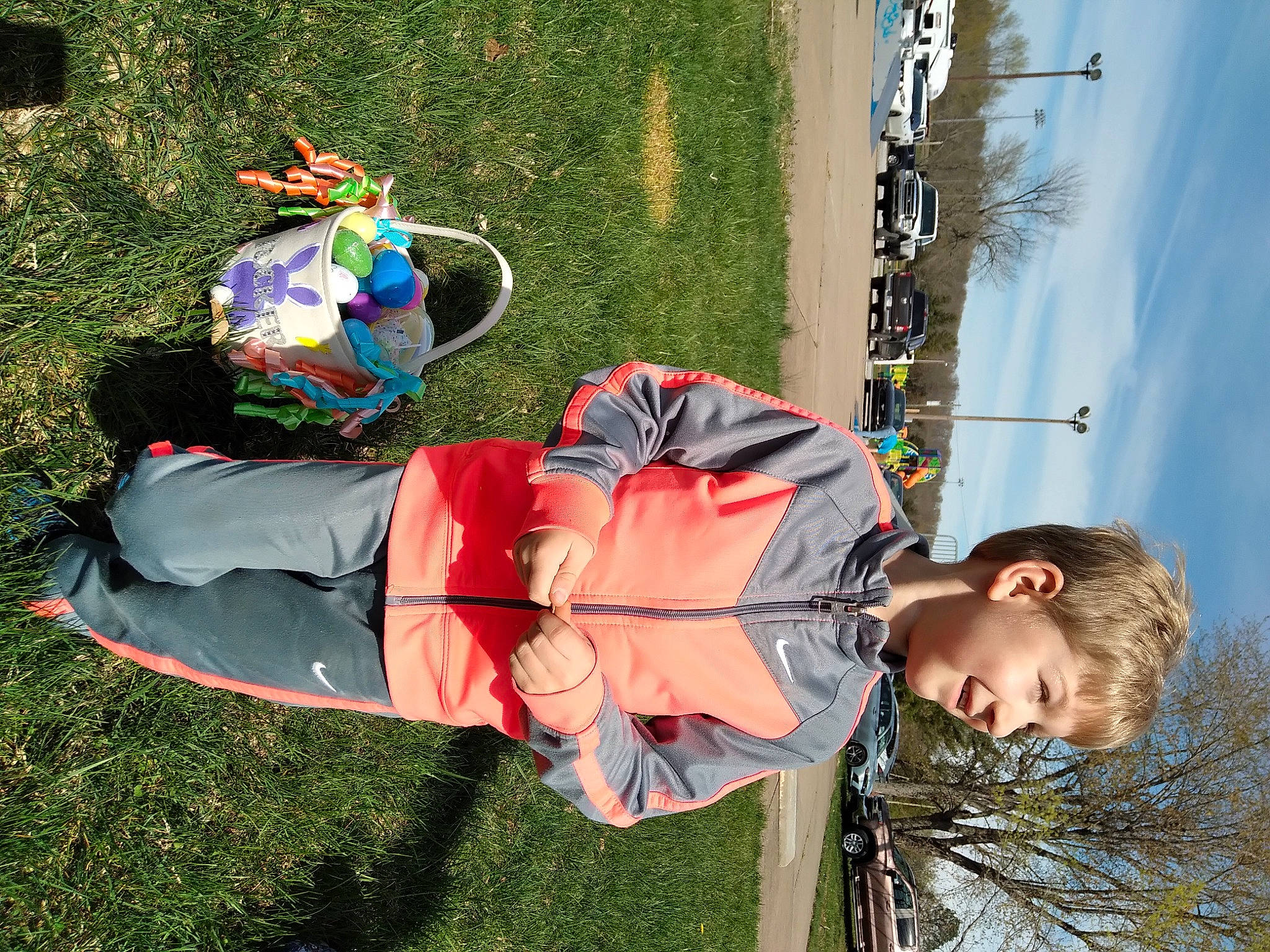Tucker is registered to the contest to win money with this photo: child, fun, grass, happy, hat, joy, leisure, people_in_nature, person, plant, recreation, sky, tire, toddler, tree, wind