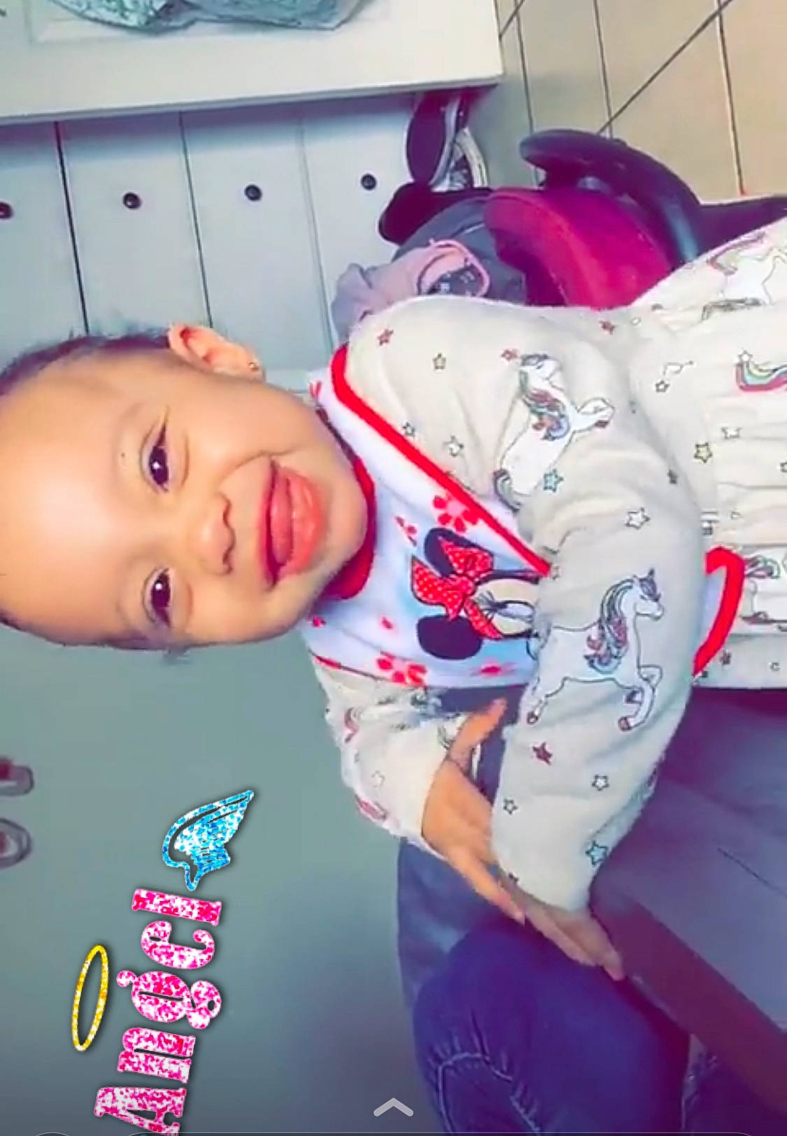 Kailani joined the competition — help win amazing prizes! baby, carmine, child, comfort, cool, elbow, electric_blue, flesh, font, fun, happy, joy, linens, mouth, person, personal_protective_equipment, pink, room, sitting, sleeve