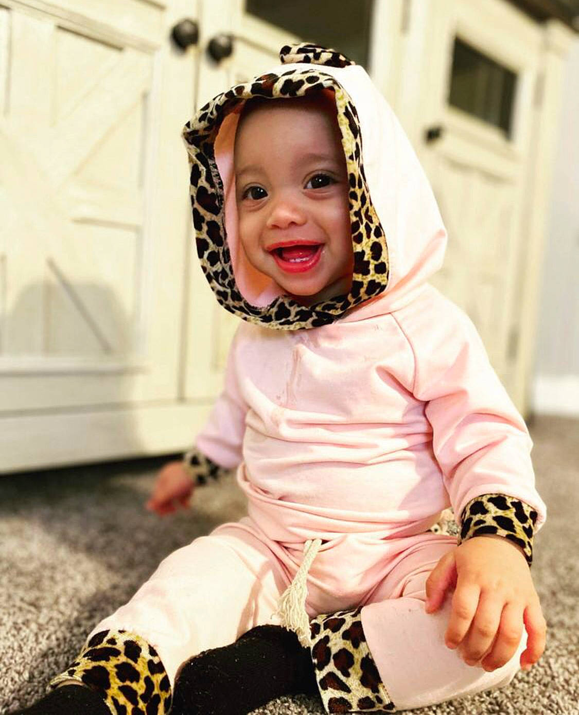 Kailani joined the competition — help win amazing prizes! audio_equipment, baby_toddler_clothing, child, costume, face, fashion_accessory, flooring, fun, happy, laugh, magenta, pattern, person, pink, portrait_photography, sitting, sleeve, smile, street_fashion, toddler