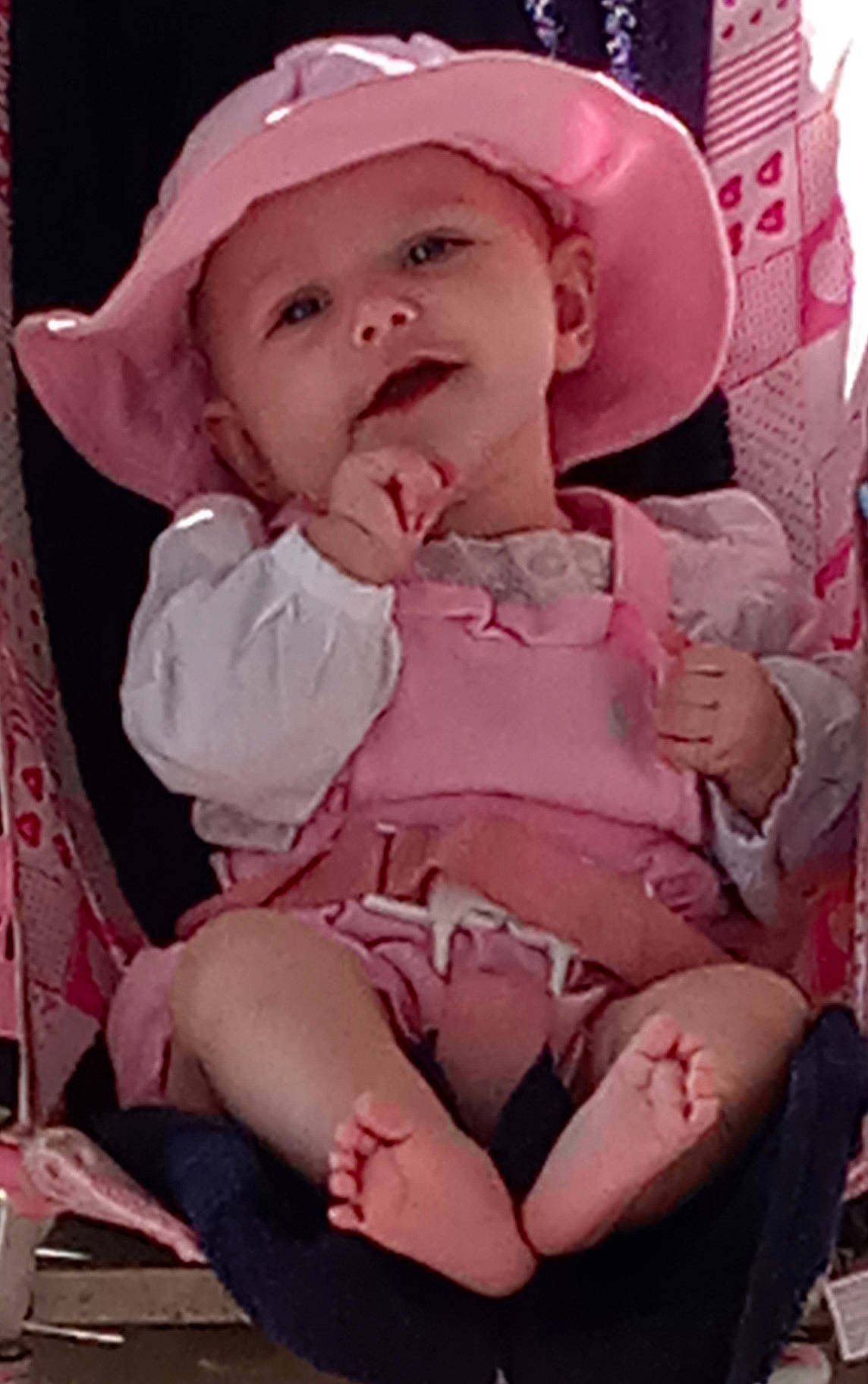 Khloe is registered to the contest to win money with this photo: baby, baby_toddler_clothing, cap, cheek, child, chin, comfort, dress, face, fashion_accessory, fun, happy, headwear, lip, magenta, mouth, person, pink, skin, sleeve