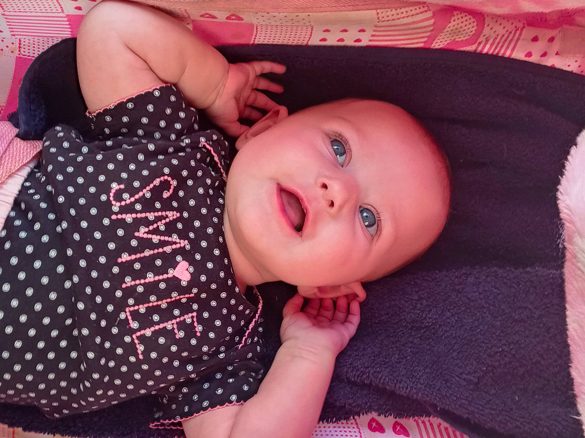 Khloe joined the competition — help win amazing prizes! arm, baby, baby_toddler_clothing, cheek, doll, eyelash, finger, hand, iris, lip, magenta, mouth, nail, nose, pattern, person, pink, skin, sleeve, smile