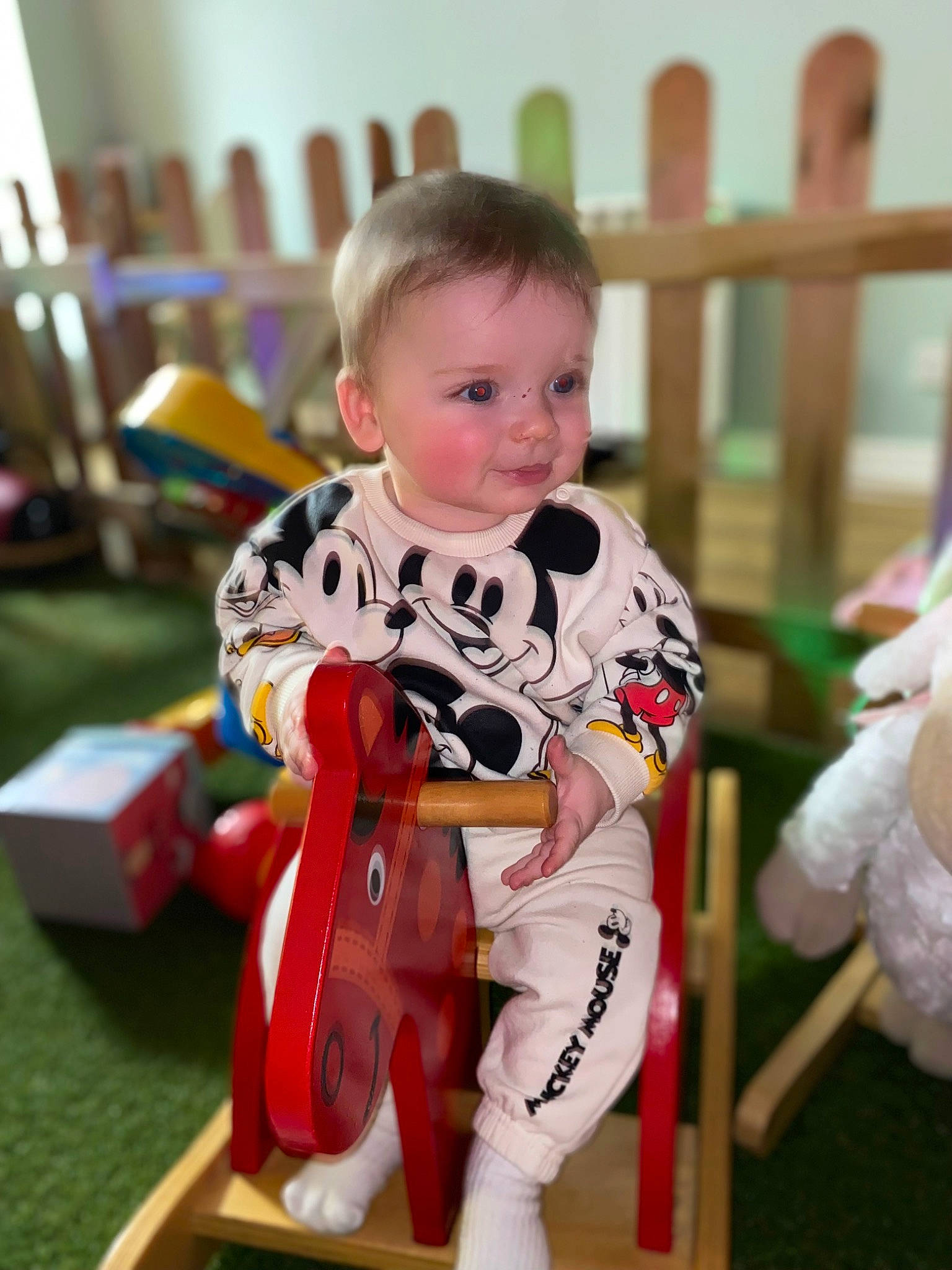 Henry joined the competition — help win amazing prizes! baby, baby_playing_with_toys, baby_toddler_clothing, carmine, child, event, fence, flooring, fun, happy, head, holiday, knee, leisure, person, play, recreation, sitting, smile, thigh