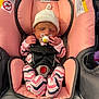 baby, car_seat, child, comfort, cute, fabric, indoor, infant, newborn, onesie, pacifier, peaceful, pink, resting, safety_harness, seat, sleeping, small_hands, warning_label, white_hat
