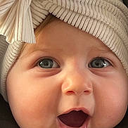 Jade a rejoint le concours — aidez-le/la à gagner de superbes lots ! baby, infant, close_up, portrait, hat, bow, big_eyes, open_mouth, smile, rosy_cheeks, chubby_cheeks, eyelashes, knit_texture, beige, clothing, car_seat, adorable, cute, face, skin