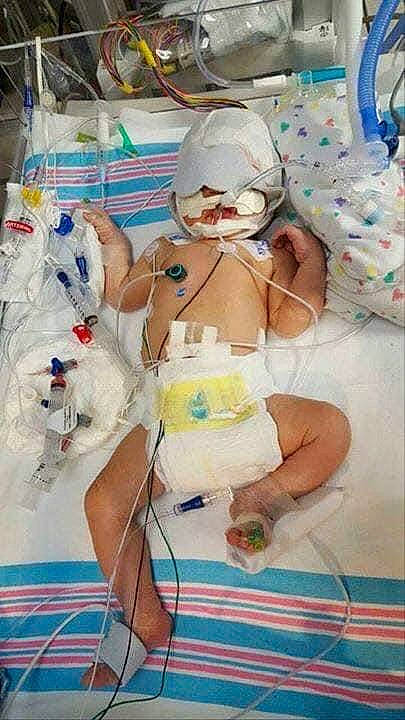 Kyler is registered to the contest to win money with this photo: astronaut, costume_design, fictional_character, linens, person, plastic