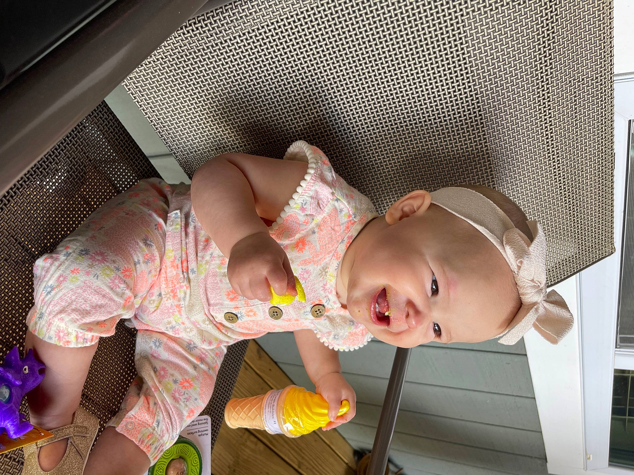 Charleigh is registered to the contest to win money with this photo: abdomen, baby, baby_products, baby_safety, baby_toddler_clothing, bed, child, comfort, fun, happy, hat, linens, pattern, person, room, sitting, thigh, toddler