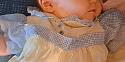 Harley joined the competition — help win amazing prizes! baby, infant, sleeping, clothing, dress, fabric, soft_light, portrait, child, cute, face, head, closeup, indoors, resting, peaceful, skin, small, person, babywear
