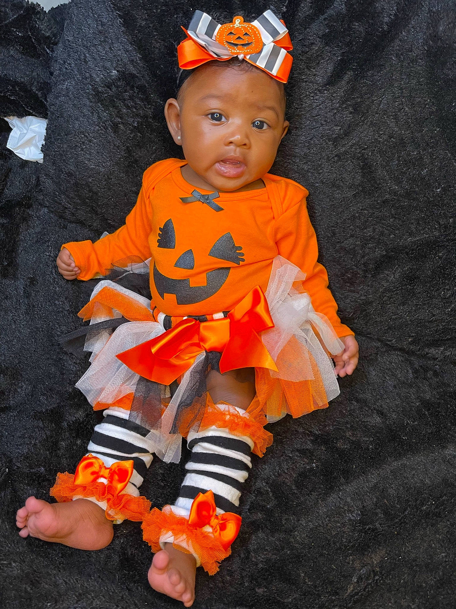 Qhalani joined the competition — help win amazing prizes! baby, baby_products, baby_toddler_clothing, child, costume, fun, glove, happy, headband, orange, pattern, peach, person, personal_protective_equipment, sleeve, t_shirt, toddler, trick_or_treat