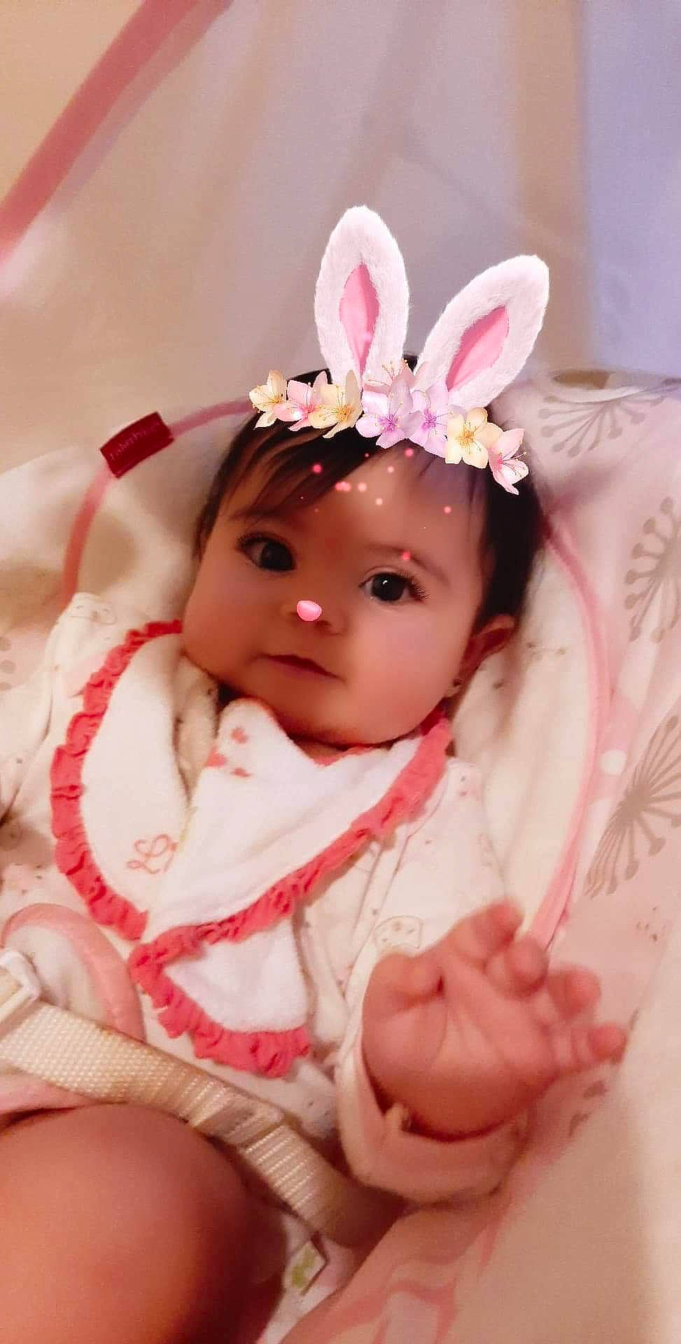 Kira is registered to the contest to win money with this photo: baby, cheek, child, ear, fashion_accessory, hair_accessory, head, headband, headgear, headpiece, headwear, person, pink, skin, toddler