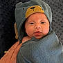 Kaesyn is registered to the contest to win money with this photo: baby, bear_hood, blanket, blue_towel, cozy, cute, face, hand, happy, indoors, infant, newborn, portrait, resting, ring, skin, soft_texture, tongue_out, towel, wrapped