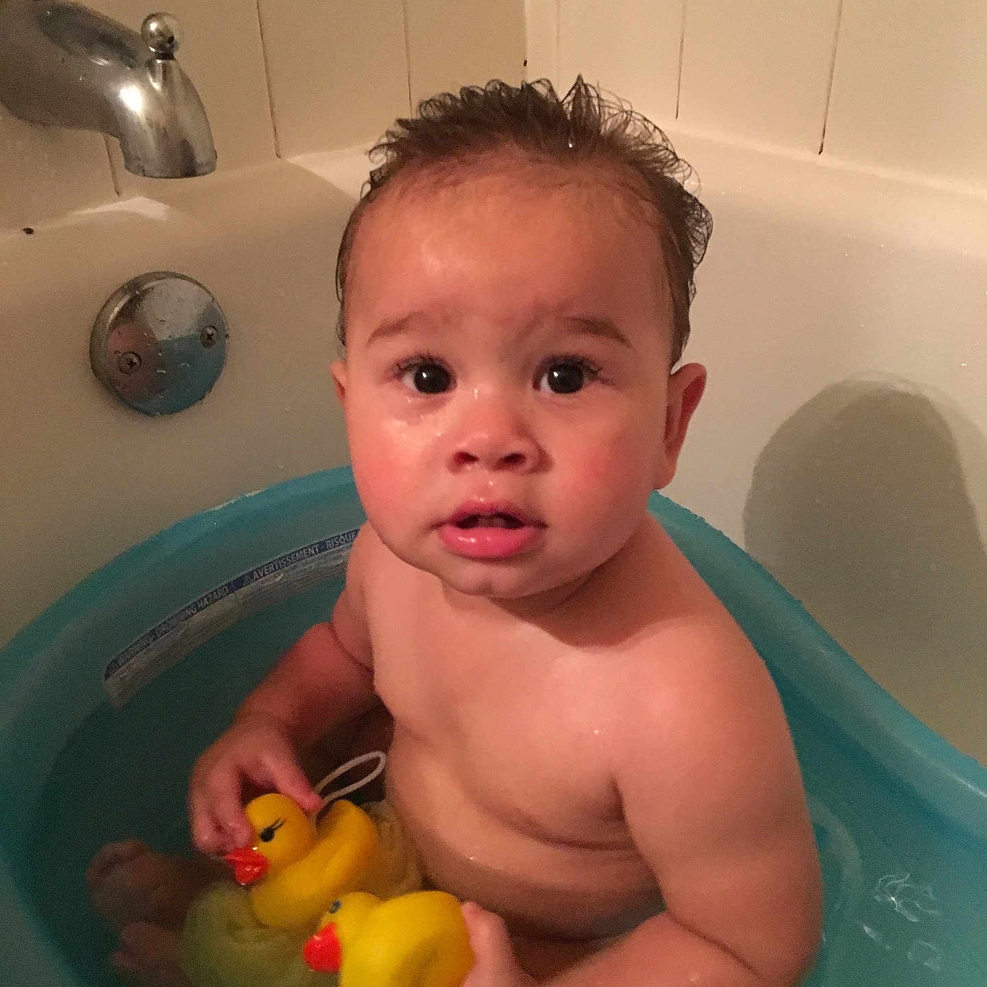 Daniel is registered to the contest to win money with this photo: baby, bathing, bathroom, bathtub, bodypart, face, finger, hand, head, indoors, person, photography, portrait, room, sink, sinkfaucet, tap, tub