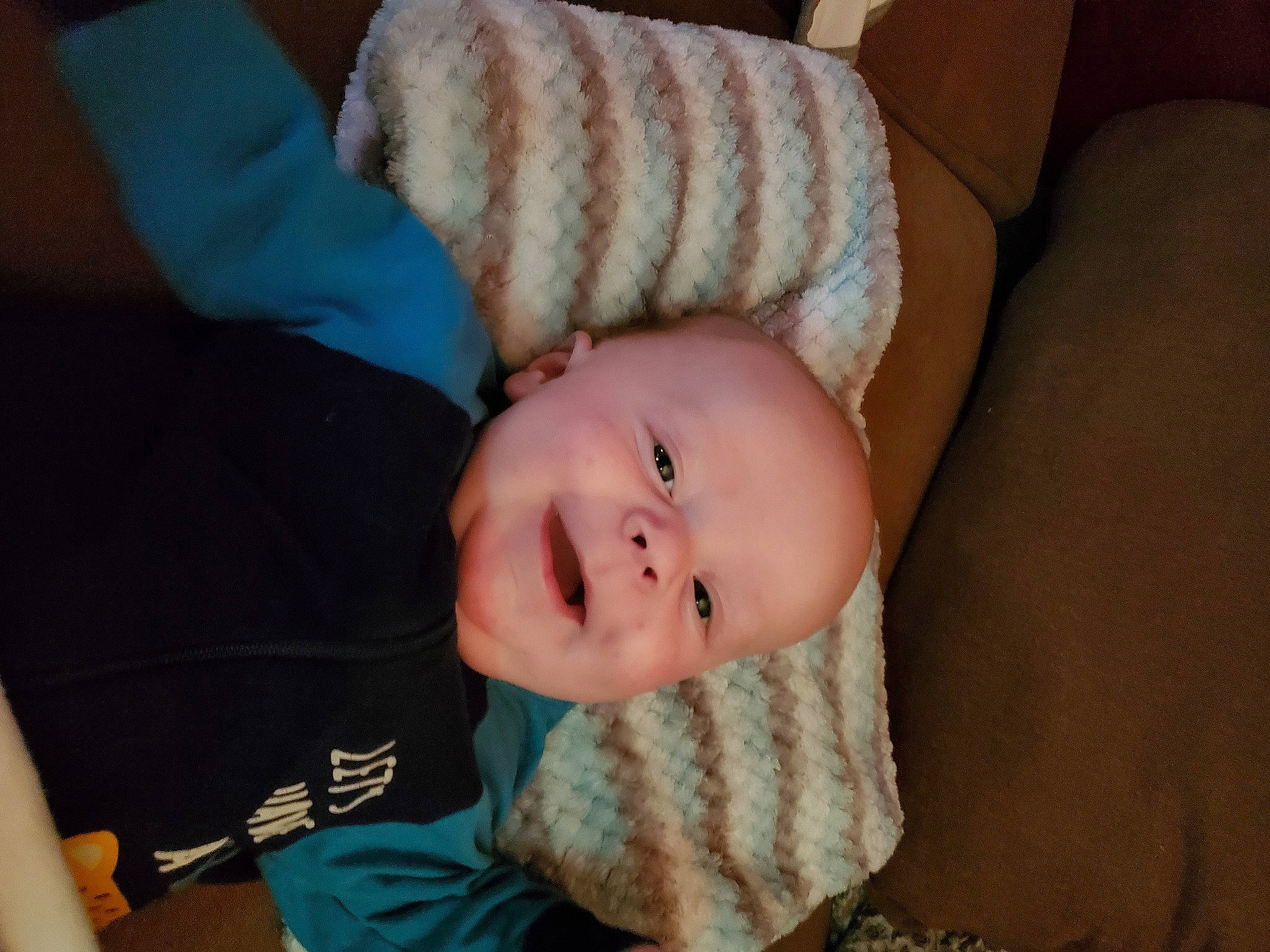 Shane joined the competition — help win amazing prizes! baby, baby_toddler_clothing, cheek, child, comfort, couch, eye, eyebrow, flooring, iris, mouth, nose, person, room, sitting, sleeve, smile, thumb, toddler, tree