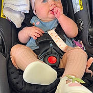 Manuela joined the competition — help win amazing prizes! baby, child, car_seat, headband, pink_bow, blue_eyes, sucking_fingers, pink_socks, white_shoes, blue_dress, infant, seat_belt, blanket, curious, cute, indoor, person, closeup, sitting, car_interior
