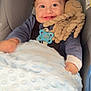 Kenzo participe au concours pour gagner de l'argent avec cette photo : baby, child, car_seat, blanket, plush_toy, octopus_toy, pacifier, smile, curly_hair, blue_clothing, happy, infant, indoor, cute, person, closeup, seatbelt, soft_texture, comfort, playful