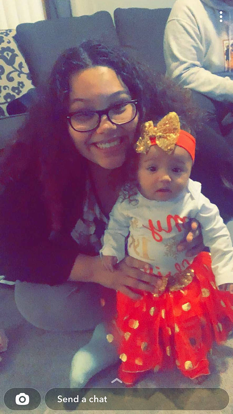 Tiana is registered to the contest to win money with this photo: baby, baby_toddler_clothing, blue, child, event, eye, eyewear, facial_expression, fun, glasses, happy, headwear, holiday, joy, person, pink, purple, selfie, sitting, skin