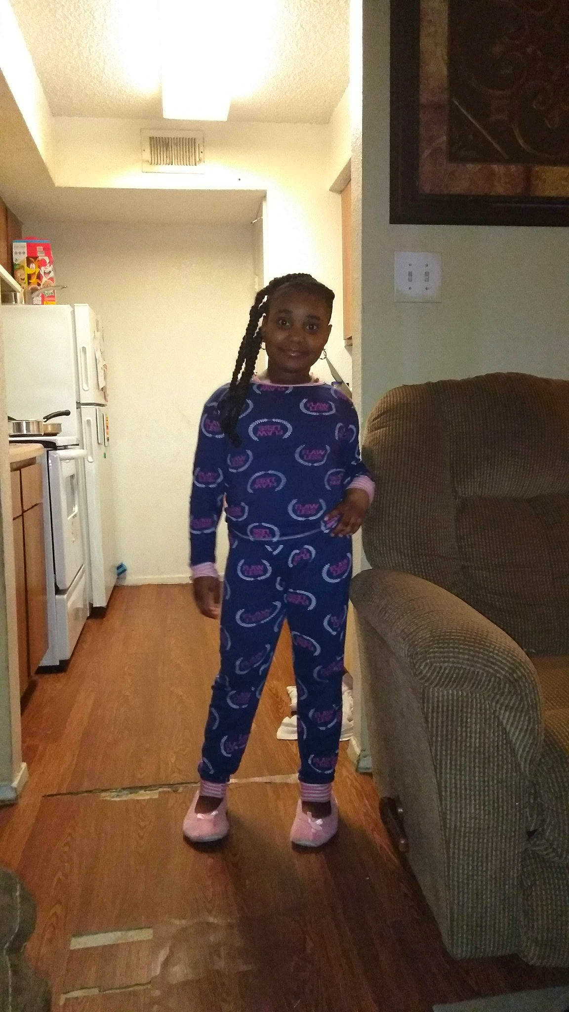 Arriana is registered to the contest to win money with this photo: child, floor, flooring, hip, joint, joy, leg, outerwear, pajamas, person, room, shoe, shoulder, sportswear, standing, toddler, trousers