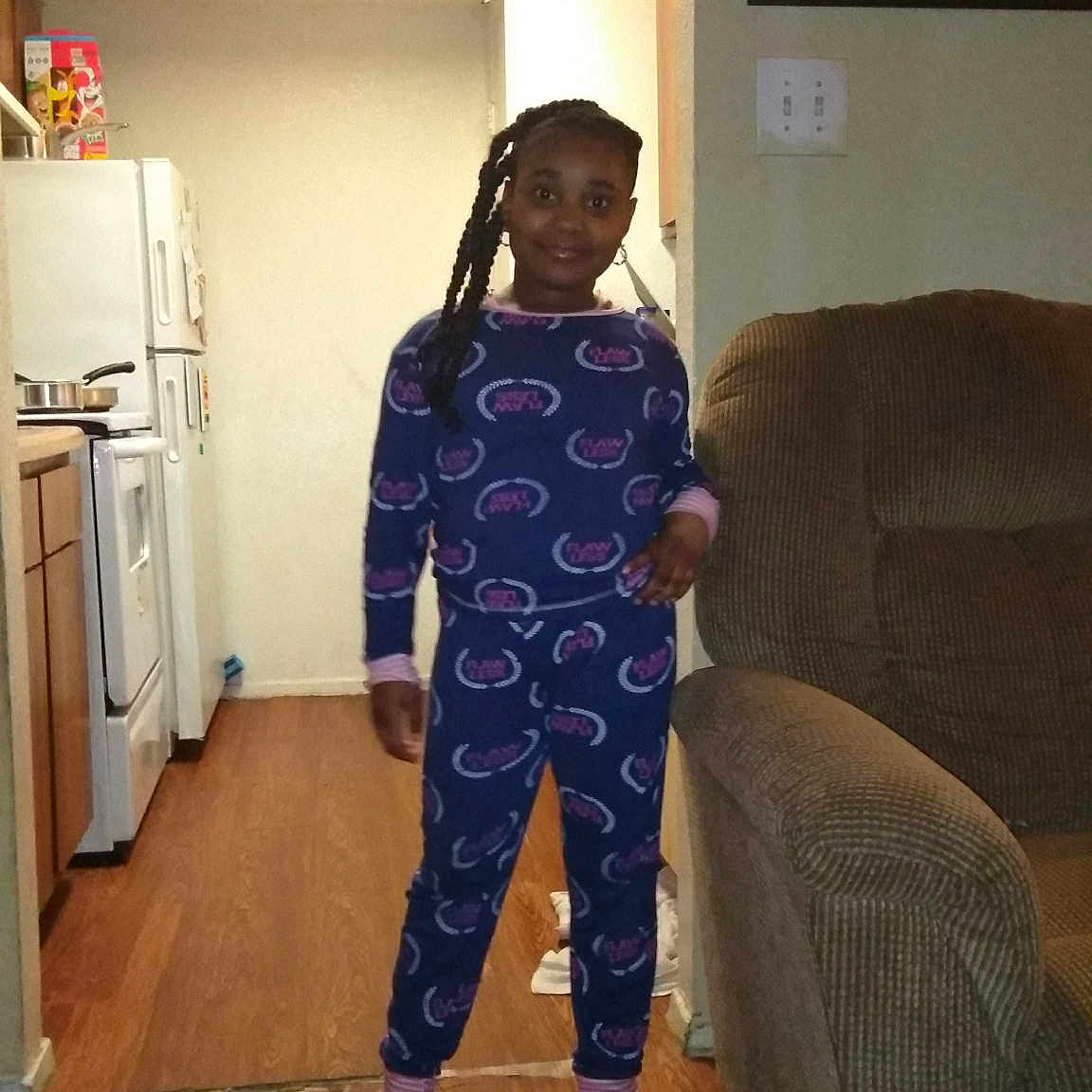 Arriana is registered to the contest to win money with this photo: child, floor, flooring, hip, joint, joy, leg, outerwear, pajamas, person, room, shoe, shoulder, sportswear, standing, toddler, trousers