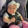 baby, car_seat, headband, bow, pink_pants, smile, child, infant, seatbelt, safety, happy, cute, indoors, person, portrait, clothing, baby_clothes, seat, car, sunlight
