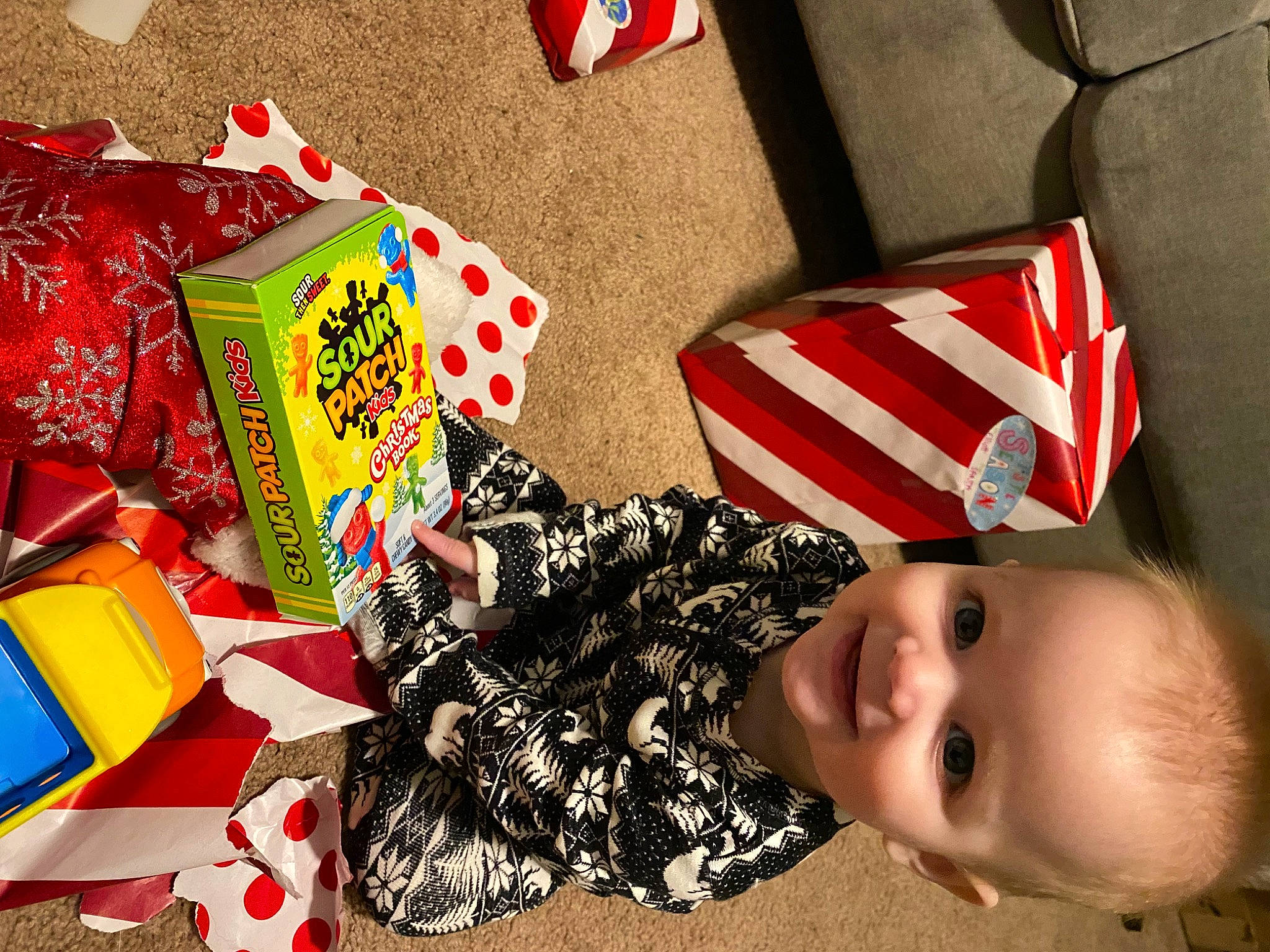 Elliott is registered to the contest to win money with this photo: baby, baby_toddler_clothing, carmine, child, event, fashion_accessory, flag, flag_of_the_united_states, happy, holiday, joy, pattern, person, present, red, smile, toddler