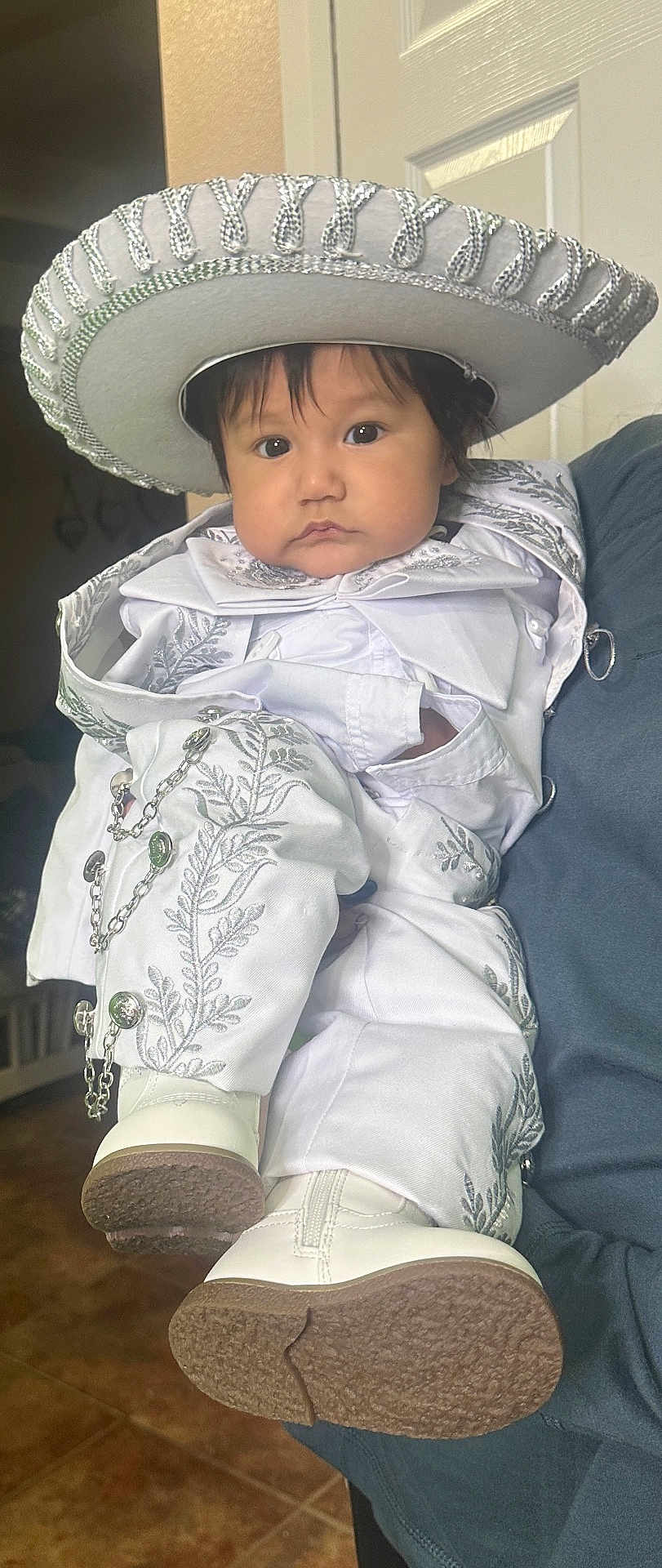Jose joined the competition — help win amazing prizes! baby, bonnet, cap, clothing, coat, costume, dress, face, footwear, hat, head, jacket, pants, person, photography, portrait, shoe, sitting, sombrero, sunhat