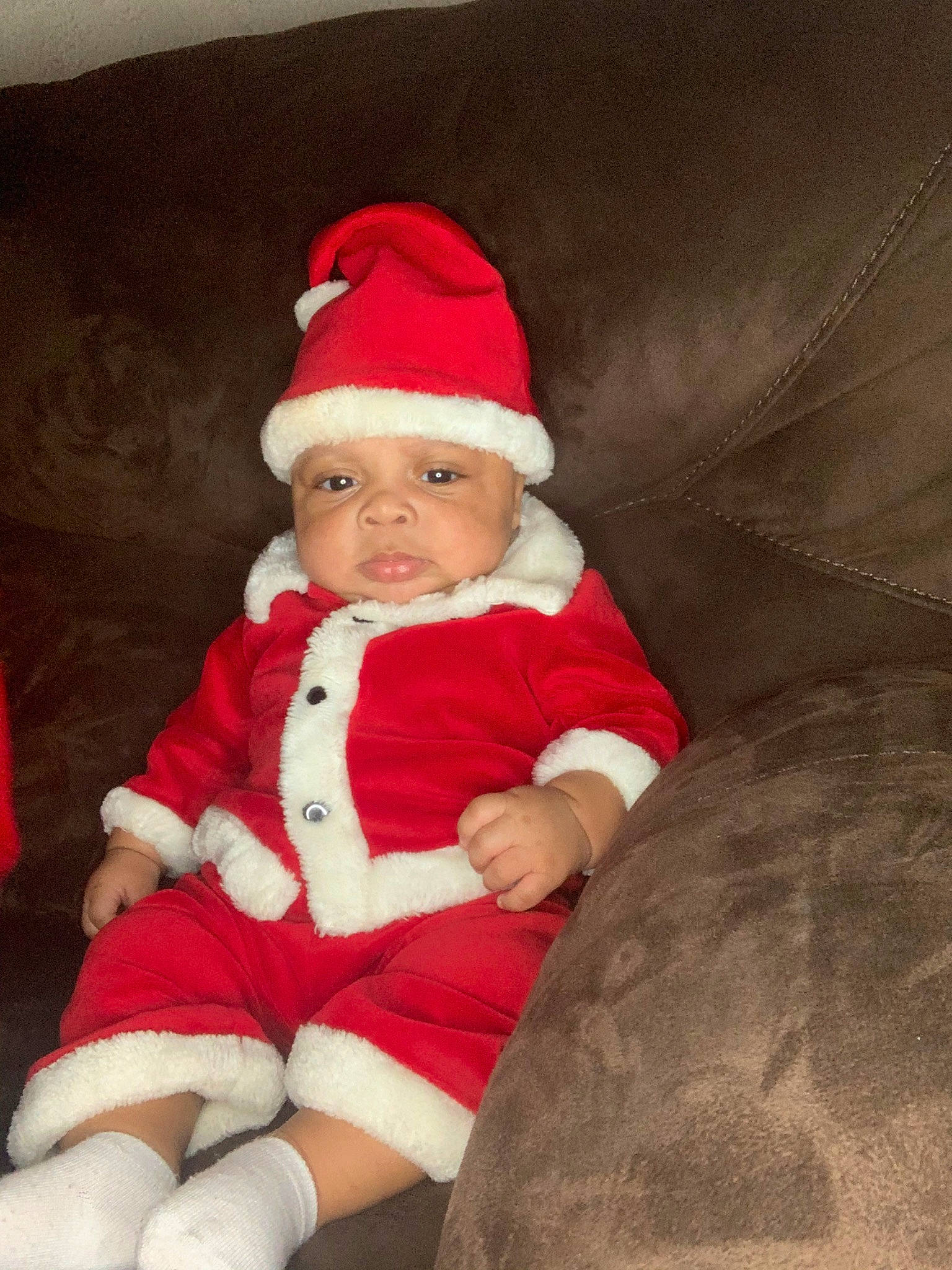 Ahmir joined the competition — help win amazing prizes! baby, baby_toddler_clothing, cap, comfort, costume_hat, event, eye, fictional_character, fur_clothing, hat, headgear, headwear, holiday, lap, leg, person, santa_claus, sitting, sleeve, sock