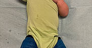 Aurora is registered to the contest to win money with this photo: baby, infant, onesie, pacifier, cast, blue_cast, legs, lying_down, child, young_child, skin, hair, hospital, medical, resting, floor, feet, clothing, person, bed