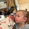 toddler, newborn, baby, hospital, blanket, curly_hair, swaddled, child, portrait, indoor, cute, infant, person, blue_eyes, clothing, headband, family, love, care, curiosity