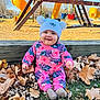 autumn, baby, child, cute, daylight, fun, grass, hat, leaves, outdoor, park, pink_clothing, play_equipment, playground, pom_pom, seasonal, slide, smiling, swing, wood