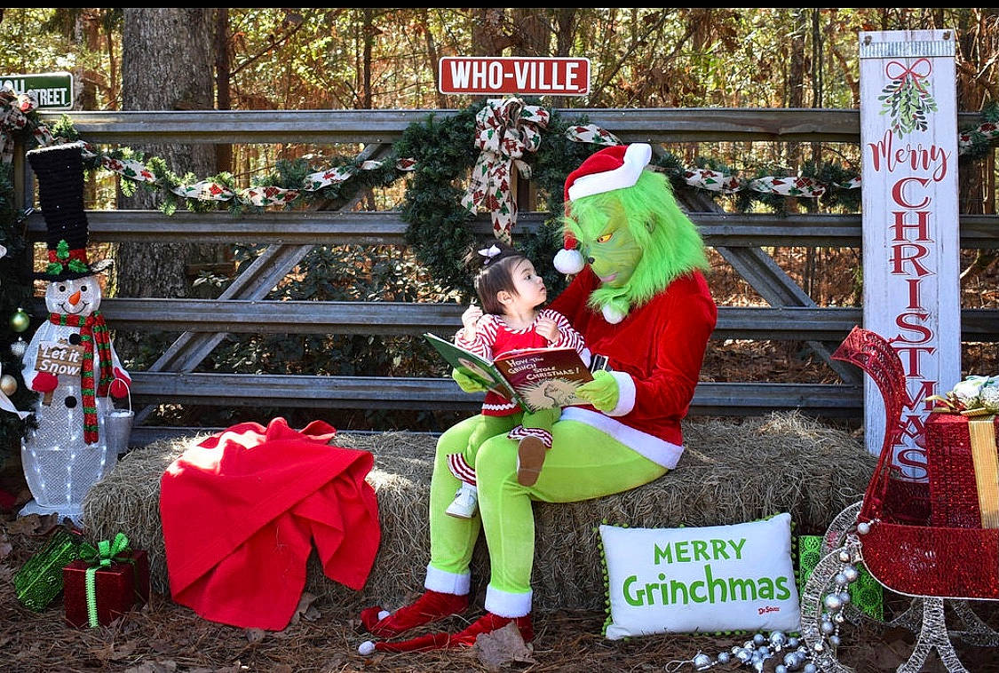 Cecilia joined the competition — help win amazing prizes! boot, carmine, christmas, christmas_decoration, christmas_eve, christmas_ornament, conifer, costume_hat, event, fictional_character, fun, hat, holiday, interior_design, lap, lawn_ornament, person, red, santa_claus, tree