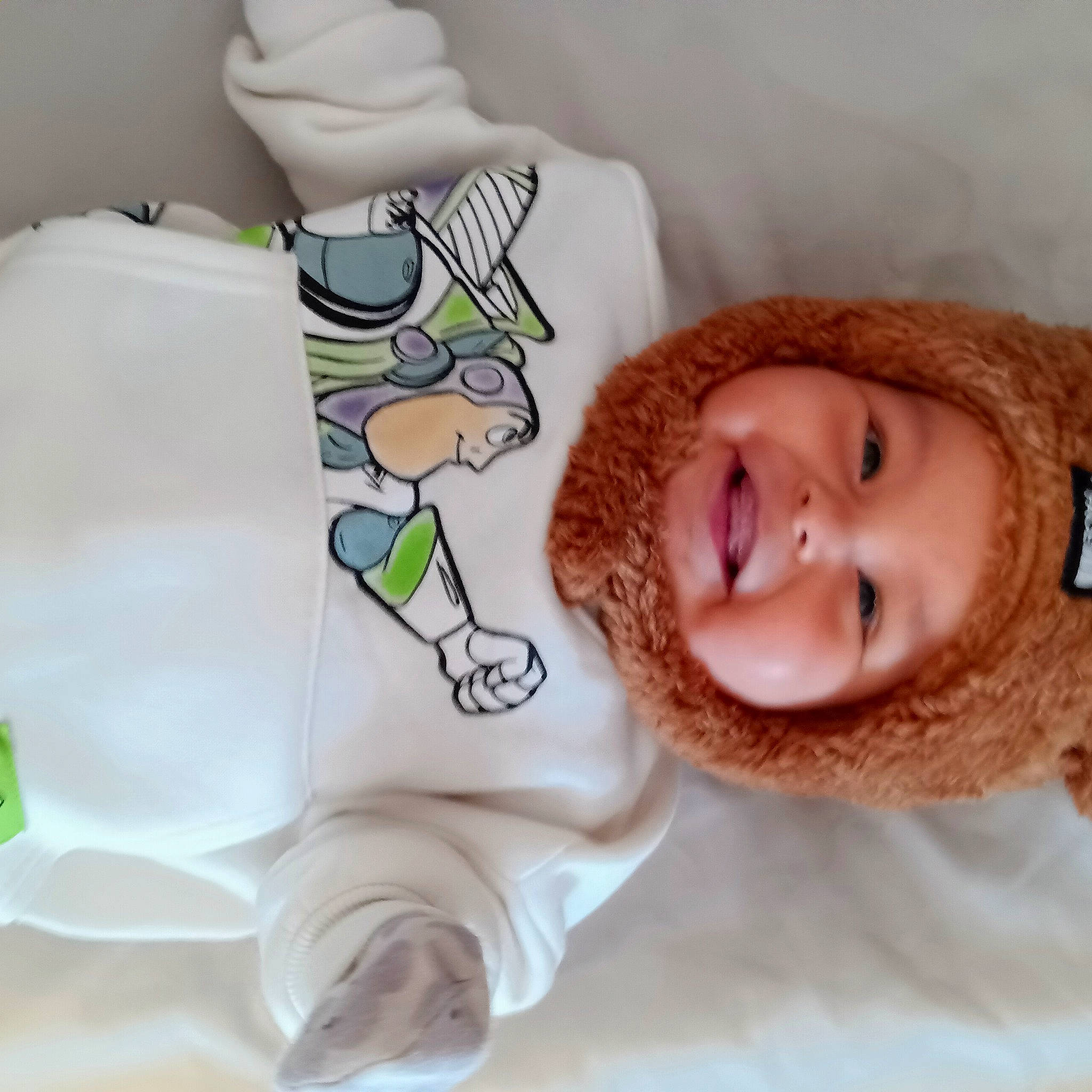 Jethro is registered to the contest to win money with this photo: baby, baby_products, baby_sleeping, baby_toddler_clothing, cheek, child, comfort, eyelash, happy, headgear, headwear, joy, linens, mouth, neck, nose, person, room, skin, sleeve
