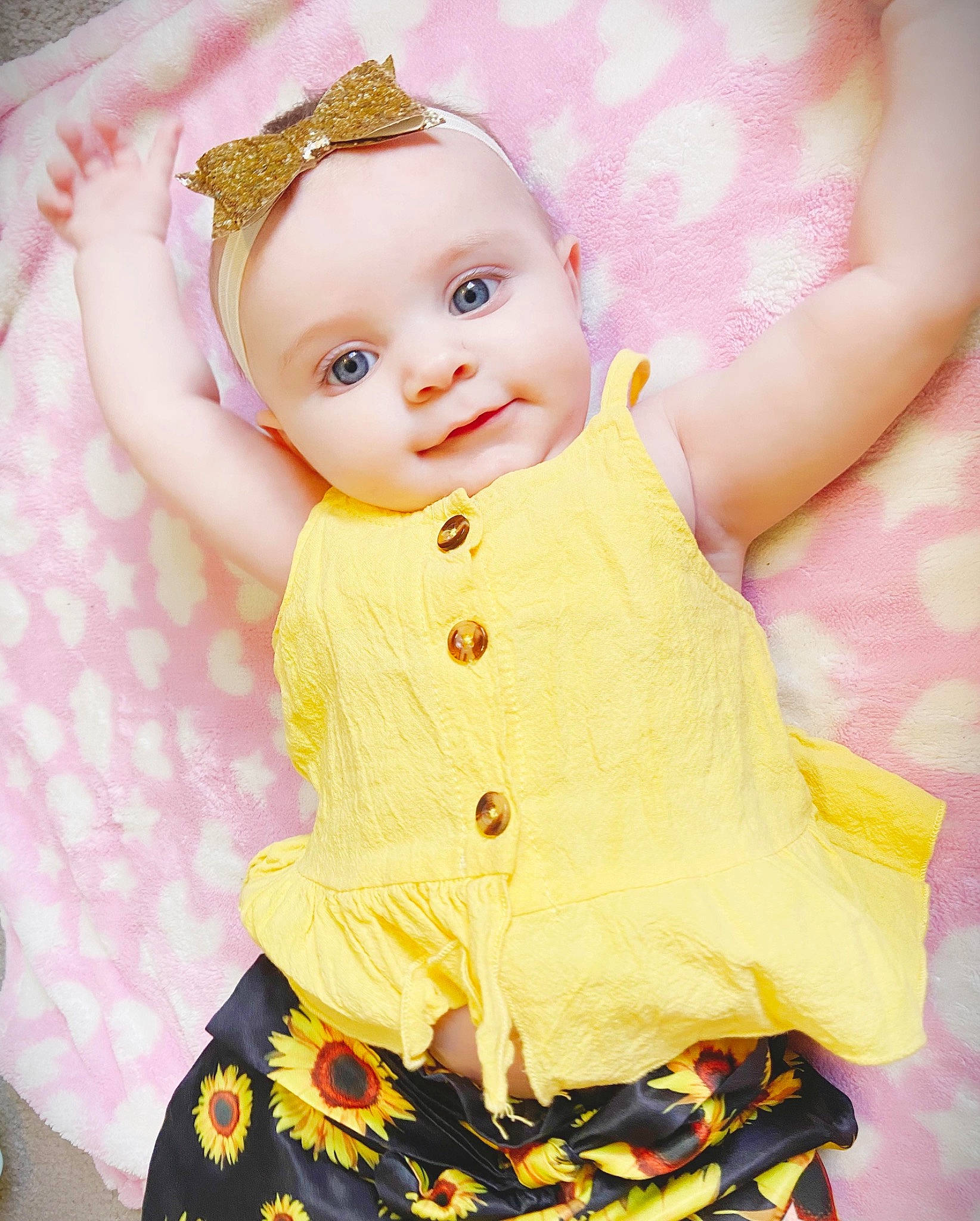 Arabella is registered to the contest to win money with this photo: baby, baby_products, baby_toddler_clothing, child, day_dress, doll, dress, eyelash, face, fashion_design, happy, magenta, pattern, peach, person, pink, skin, sleeve, textile, toddler