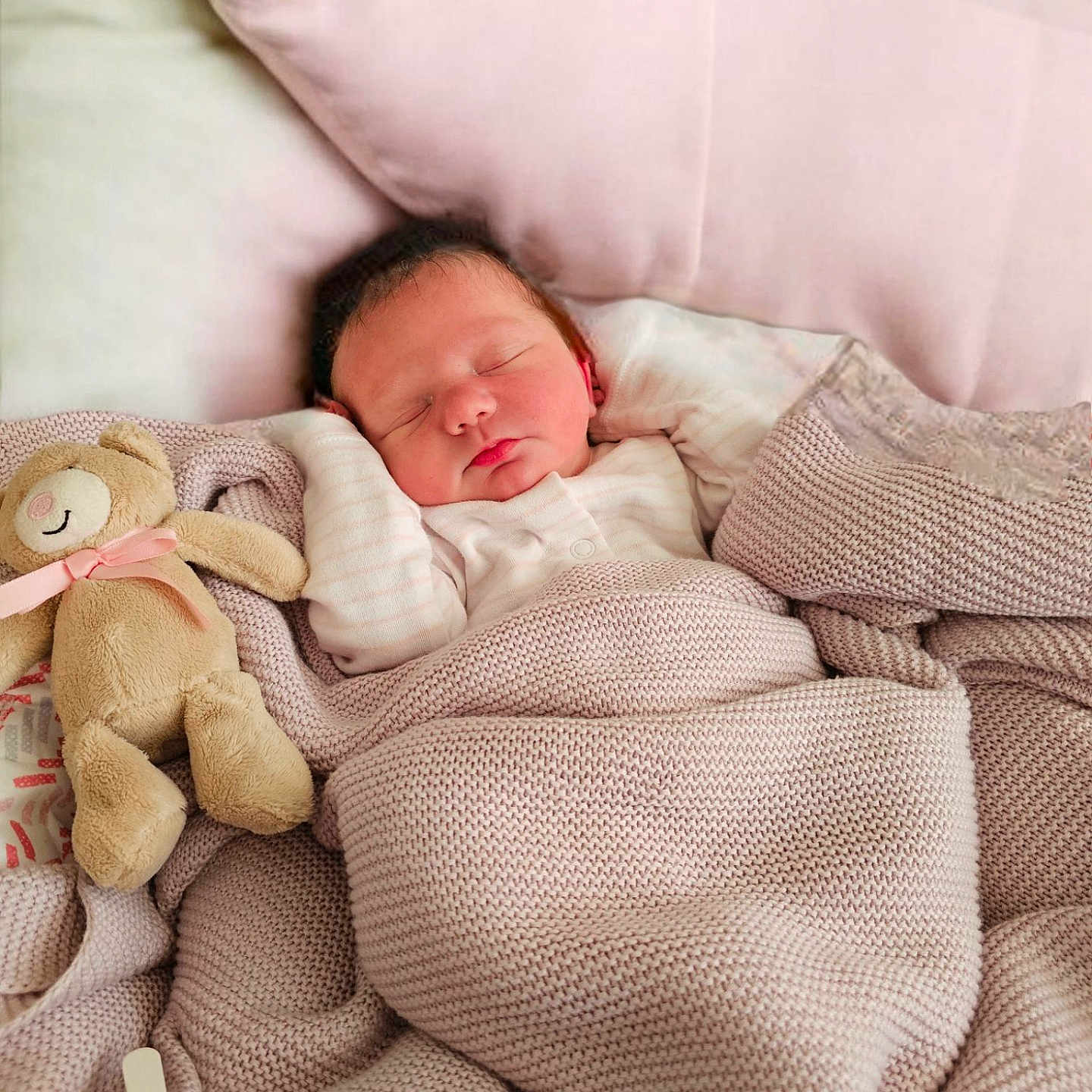 Daisy is registered to the contest to win money with this photo: baby, bed, blanket, child, clothing, cozy, cute, face, indoor, infant, knitted_blanket, newborn, pastel_colors, peaceful, pillow, portrait, resting, sleeping, soft_toys, teddy_bear