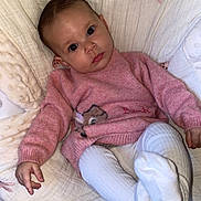 Maya participe au concours pour gagner de l'argent avec cette photo : baby, infant, pink_sweater, white_tights, cushion, bunny_design, soft_texture, indoor, portrait, child, cute, cozy, seated, floor_tiles, small_hand, head_tilt, curious, wide_eyes, clothing, baby_girl