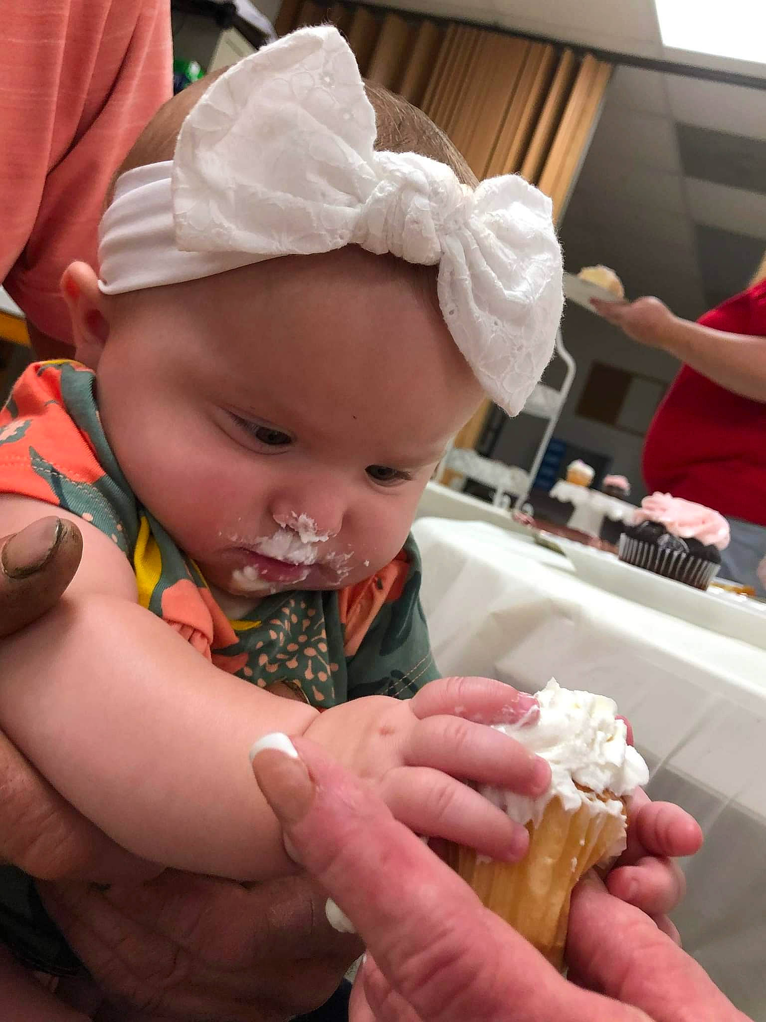 Pheonix is registered to the contest to win money with this photo: baby, baby_toddler_clothing, cap, child, comfort_food, cuisine, delicacy, dessert, fashion_accessory, finger_food, food, food_craving, hand, hat, headwear, ice_cream, ingredient, nail, person, sweetness