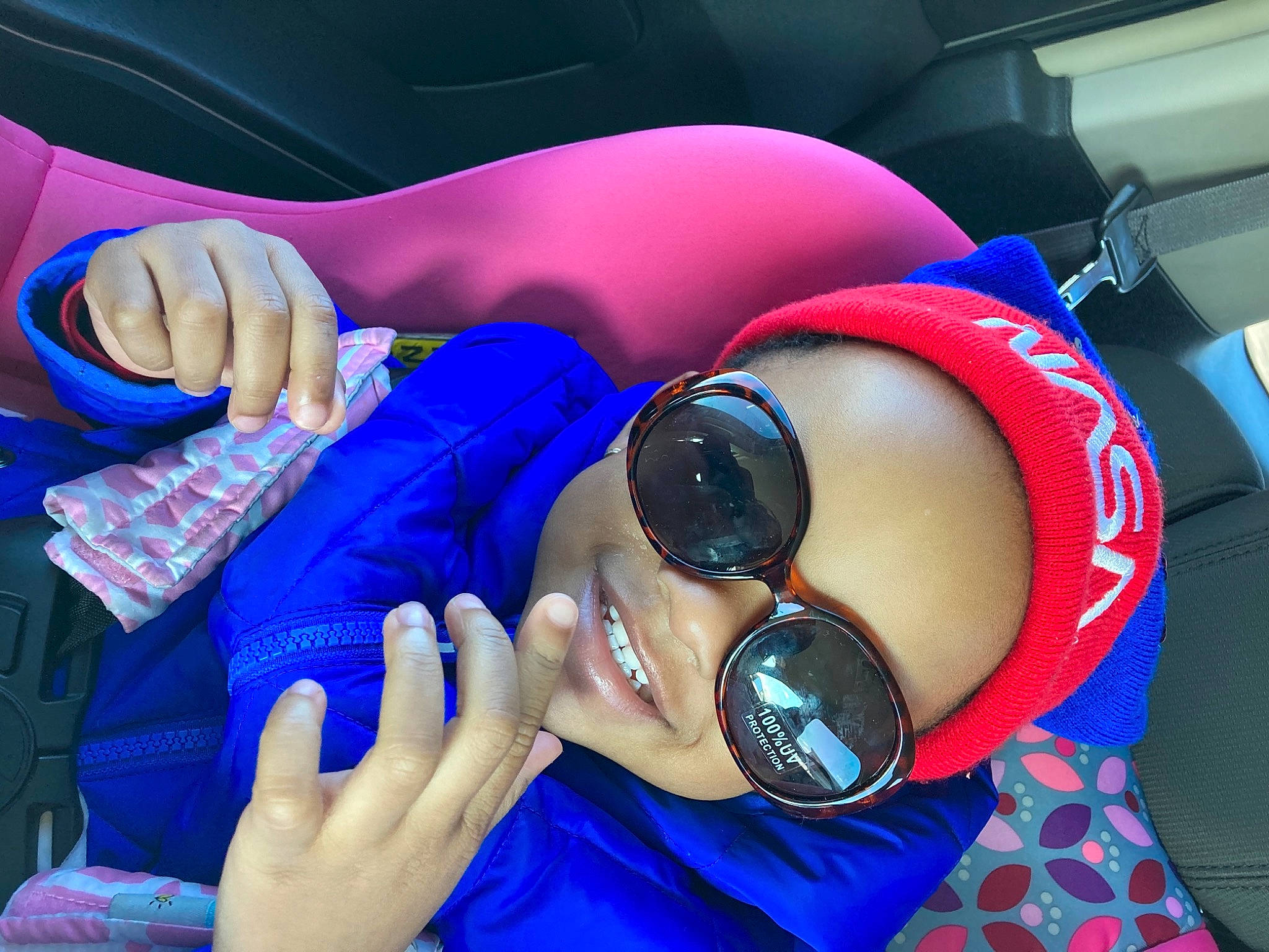 Miranda is registered to the contest to win money with this photo: audio_equipment, automotive_design, black_hair, blue, dress, electric_blue, entertainment, eyewear, finger, goggles, hand, leg, leisure, nail, person, personal_protective_equipment, red, sunglasses, thigh, thumb