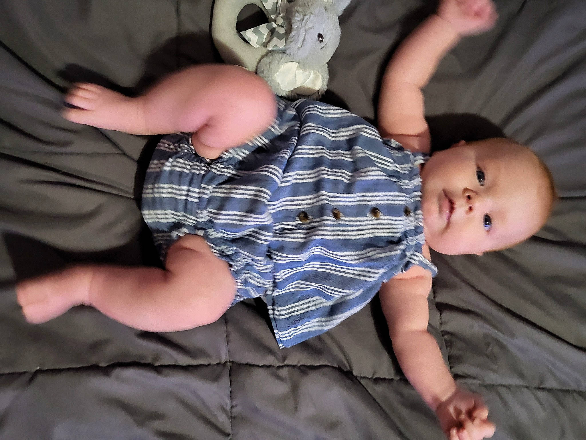 Jade is registered to the contest to win money with this photo: arm, baby, baby_toddler_clothing, comfort, elbow, finger, fun, gesture, happy, head, joint, leg, mammal, person, t_shirt, textile, thigh, toddler, toy, trunk