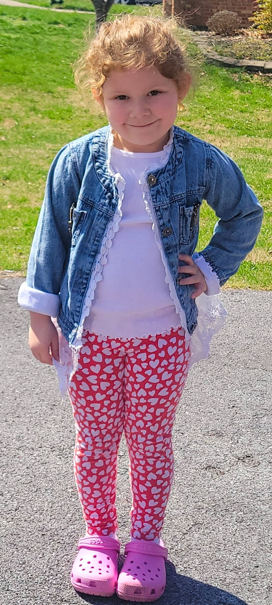 Raeleigh is registered to the contest to win money with this photo: baby_toddler_clothing, cap, child, denim, electric_blue, fashion_accessory, formal_wear, grass, happy, jewellery, joy, pattern, person, personal_protective_equipment, shoulder, sleeve, sportswear, sunglasses, t_shirt, textile