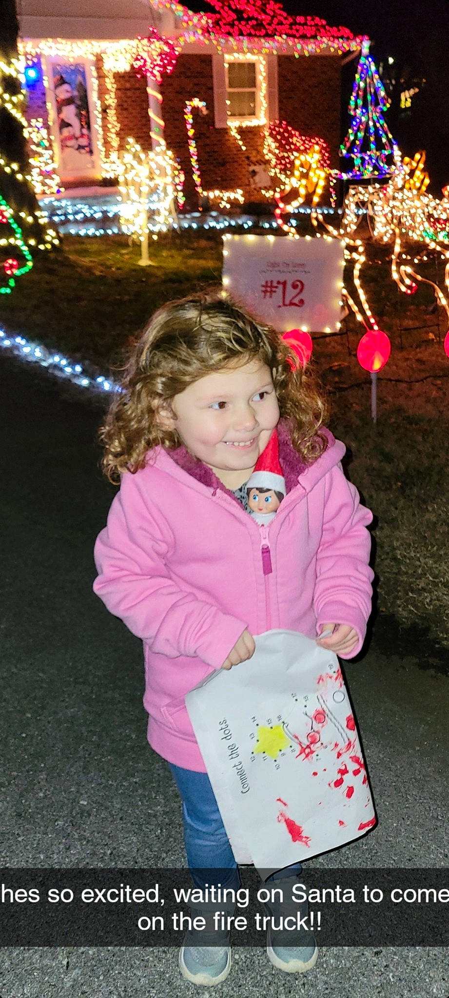 Raeleigh joined the competition — help win amazing prizes! baby_toddler_clothing, child, christmas_decoration, clothing, event, facial_expression, fashion, fun, happy, jacket, joy, light, outerwear, person, photograph, pink, sleeve, snapshot, standing, toddler