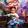 Yaziila is registered to the contest to win money with this photo: toddler, child, birthday, tutu, shoes, basket, green_carpet, wooden_crates, flowers, earrings, braided_hair, smiling, indoor, portrait, colorful, decor, cartoon_backdrop, playful, cute, celebration