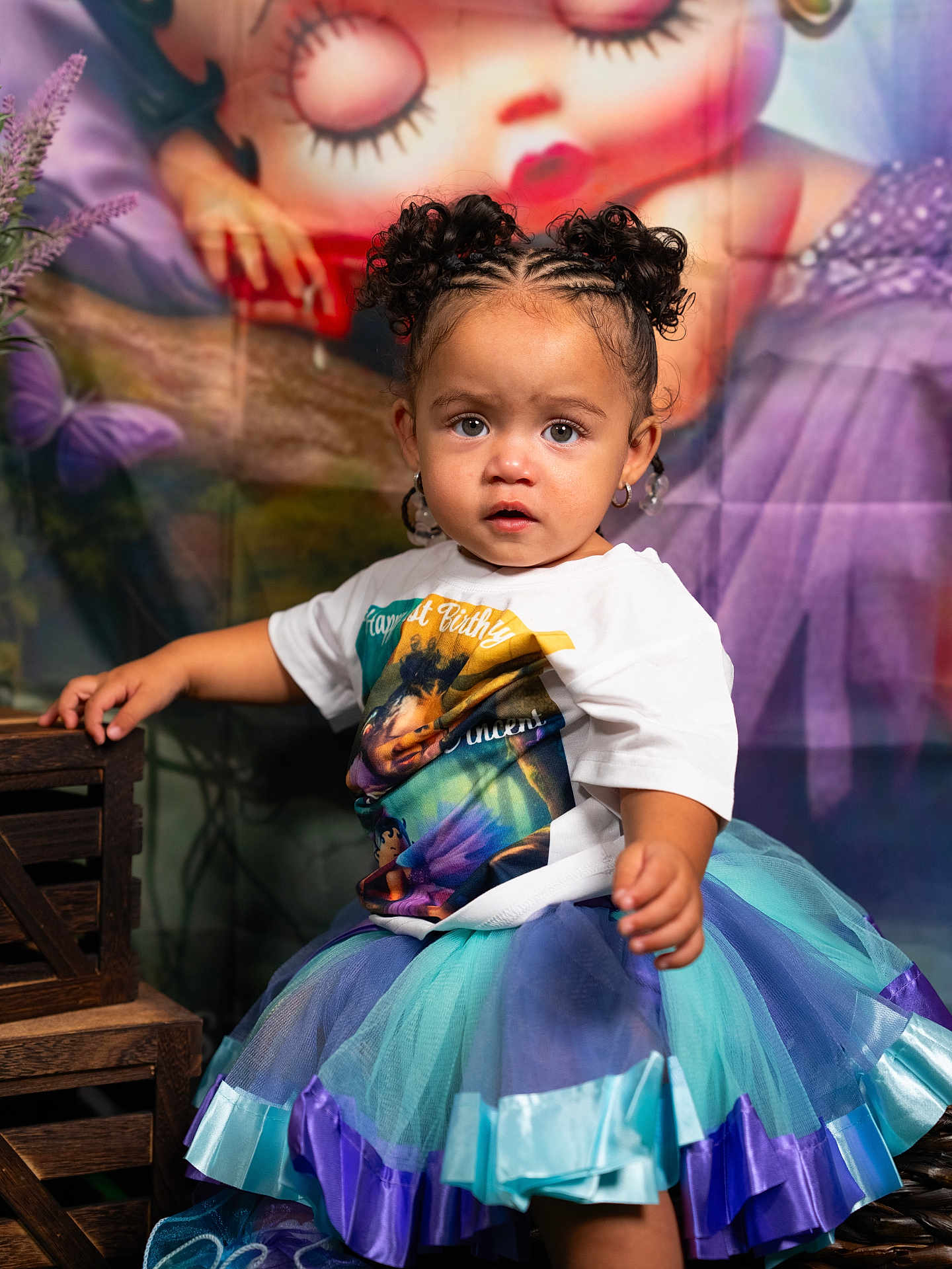 Yaziila joined the competition — help win amazing prizes! toddler, child, braided_hair, tutu, tshirt, earrings, wooden_crate, mural, illustration, colorful, portrait, indoor, curious_expression, puffy_buns, purple, blue, decor, person, young_child, fashion