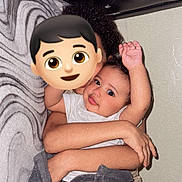 Christ is registered to the contest to win money with this photo: baby, child, blanket, hug, arm, indoor, wall, pattern, person, clothing, smile, skin, hair, holding, cuddle, expression, face, toddler, sitting, comfort