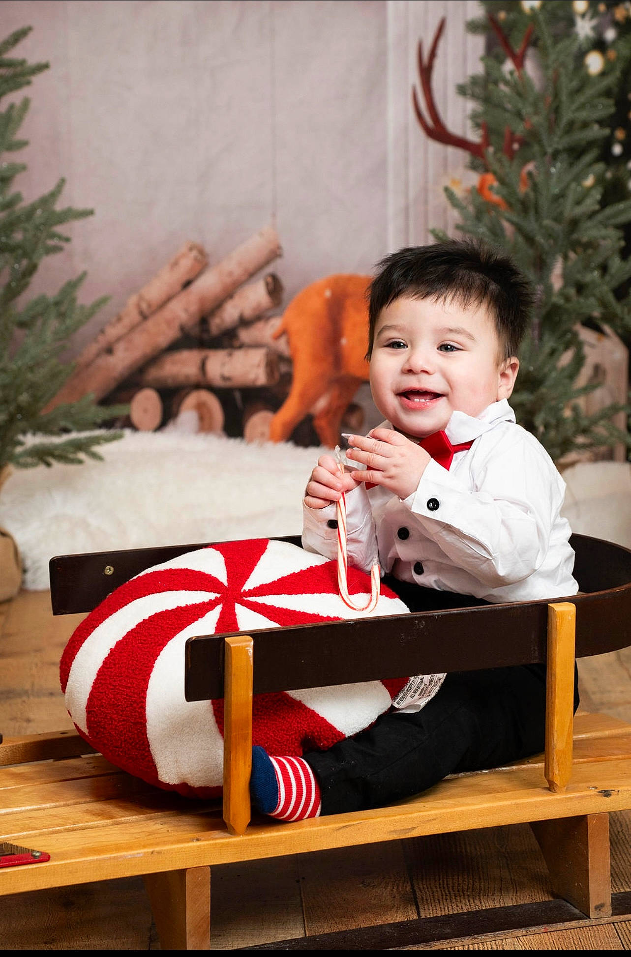 Ace Delles is registered to the contest to win money with this photo: baby, child, christmas, christmas_decoration, christmas_eve, christmas_ornament, christmas_stocking, comfort, event, happy, holiday, joy, lap, ornament, person, sitting, sleeve, smile, toddler, tradition