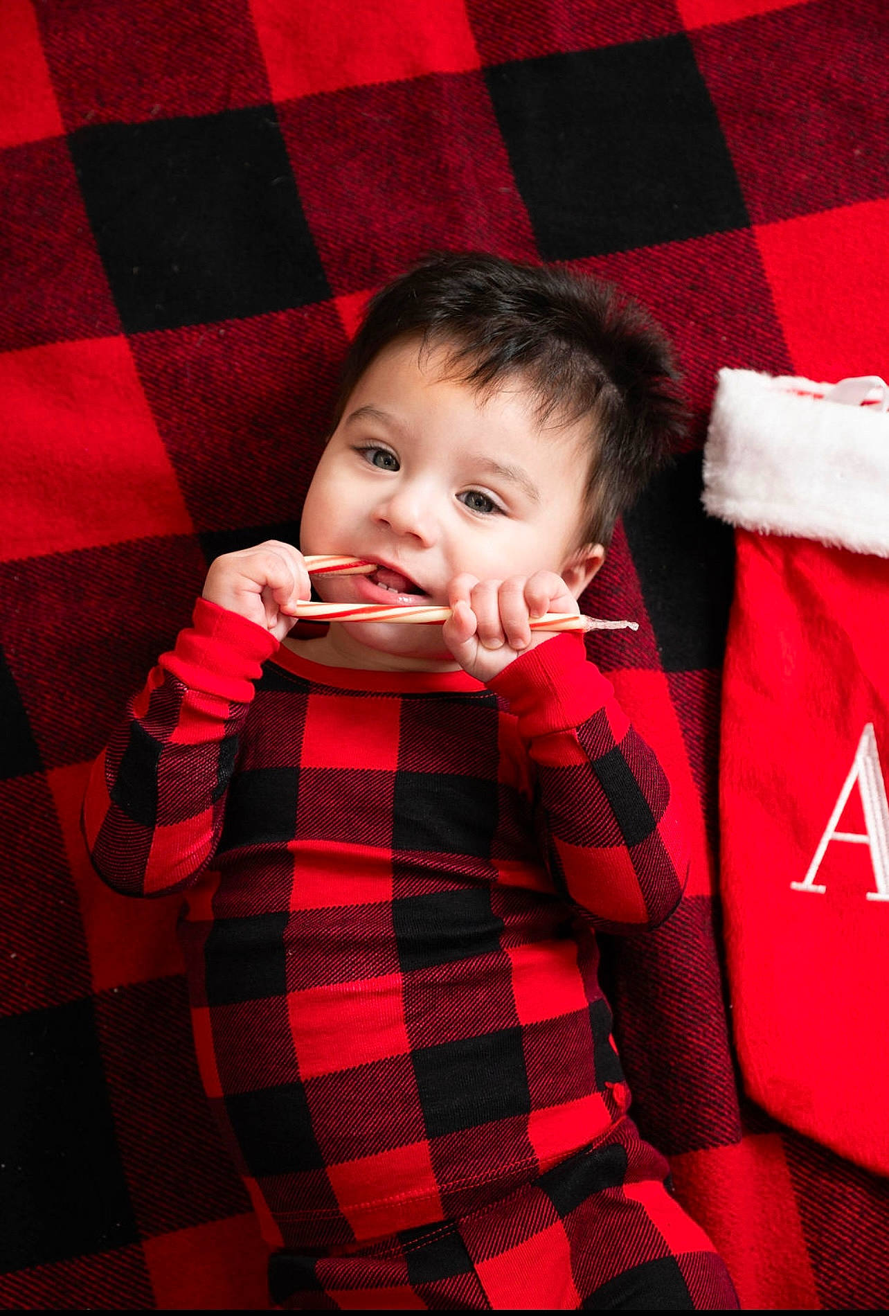 Ace Delles is registered to the contest to win money with this photo: baby, baby_toddler_clothing, child, collar, face, facial_expression, flash_photography, hand, happy, pattern, people, person, plaid, product, red, sleeve, smile, standing, tartan, textile