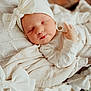 Lorelei is registered to the contest to win money with this photo: newborn, baby, sleeping, blanket, headband, bow, cozy, soft, infant, cute, wrapped, sleep, peaceful, indoors, portrait, closeup, child, toddler, warm, resting