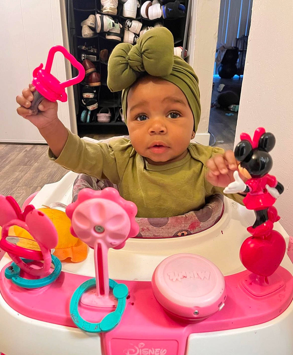 Deasia is registered to the contest to win money with this photo: audio_equipment, baby, baby_playing_with_toys, baby_products, baby_toddler_clothing, baby_toys, child, fun, happy, headwear, magenta, party_supply, person, pink, plastic, play, product, room, sitting, toddler