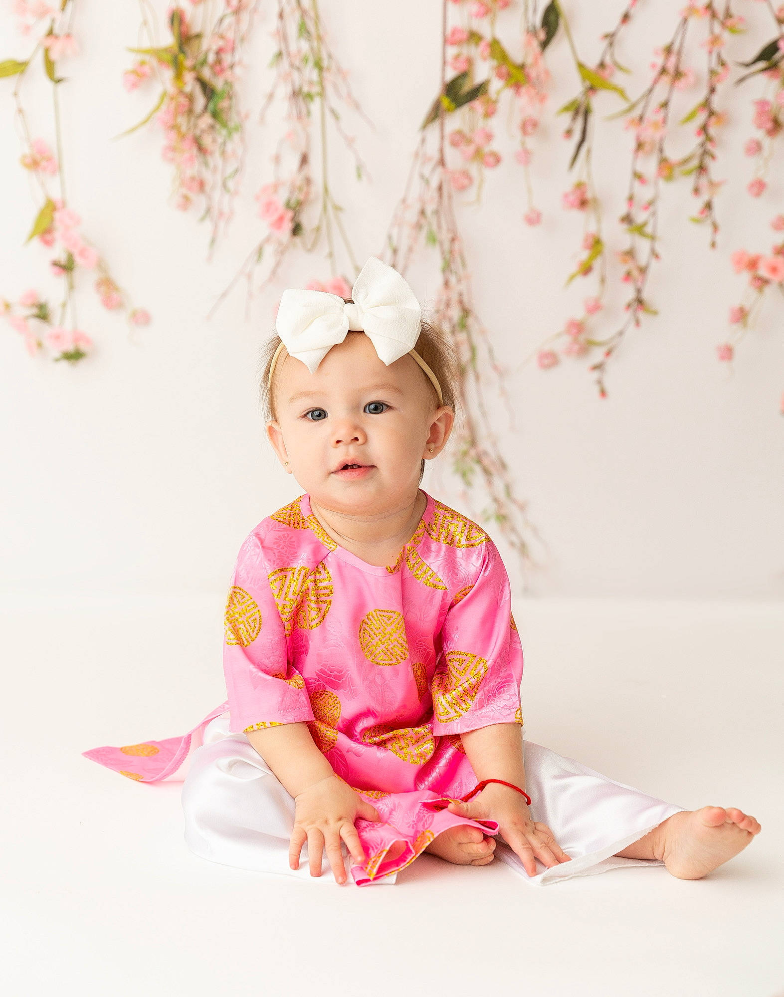 Valencia joined the competition — help win amazing prizes! baby, baby_toddler_clothing, blossom, child, fashion_accessory, flower, hair_accessory, happy, headpiece, headwear, magenta, pattern, peach, person, petal, pink, portrait_photography, sitting, sleeve, t_shirt