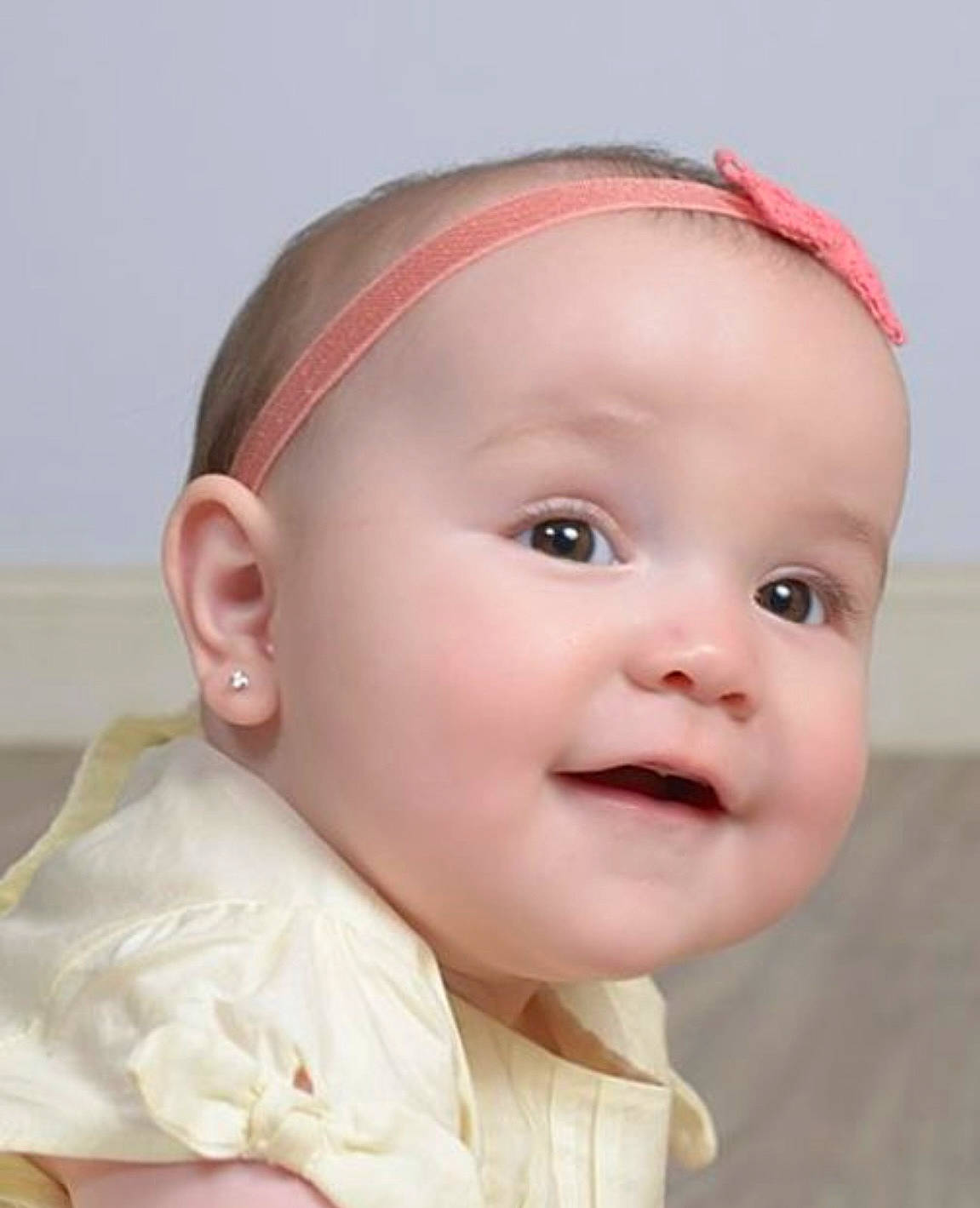 Giulia is registered to the contest to win money with this photo: baby, baby_toddler_clothing, cheek, child, chin, ear, eyelash, face, fashion_accessory, hair_accessory, happy, headgear, headpiece, iris, lip, nose, person, skin, sleeve, smile