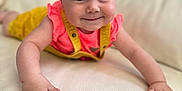 Zaya participe au concours pour gagner de l'argent avec cette photo : baby, child, closeup, couch, crawling, cute, face, hands, happy, headband, indoor, infant, leather, overalls, person, pink, portrait, smiling, white, yellow
