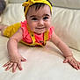baby, child, closeup, couch, crawling, cute, face, hands, happy, headband, indoor, infant, leather, overalls, person, pink, portrait, smiling, white, yellow