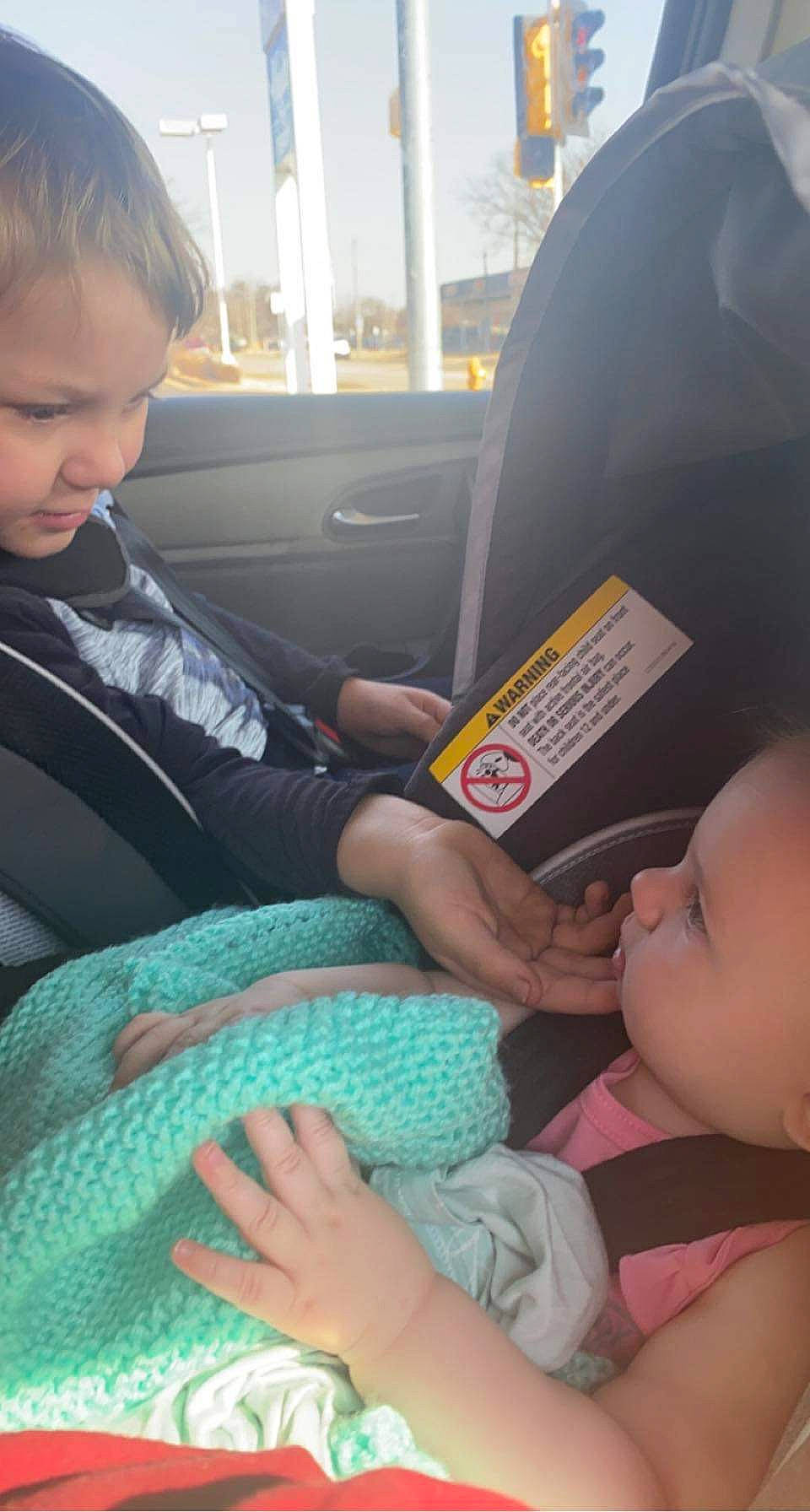 Jaxson joined the competition — help win amazing prizes! car, car_seat_cover, child, comfort, finger, gesture, hand, head, human, interaction, mammal, motor_vehicle, mouth, person, product, seat_belt, skin, thumb, vehicle_door, vertebrate